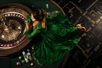 A cheerful woman in traditional clothing using her smartphone during a festive moment, showing how easily the 2777DET app fits into everyday life.